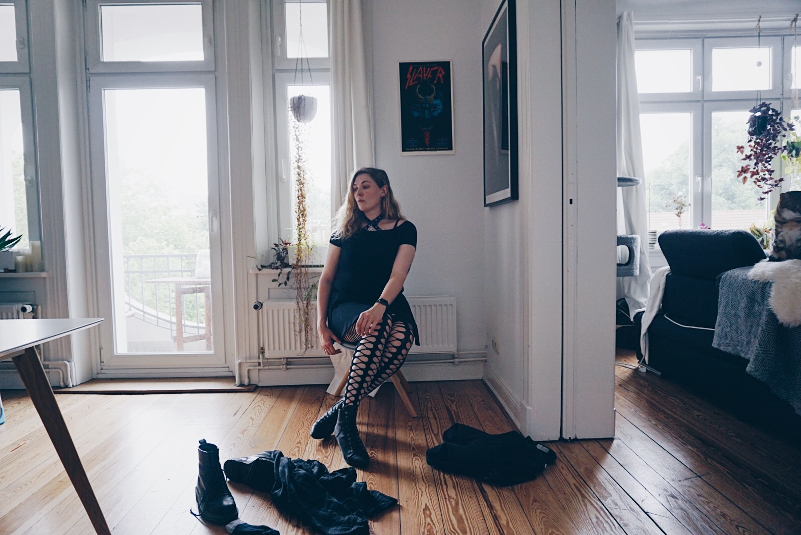 young women sitting ona chair in male clothes